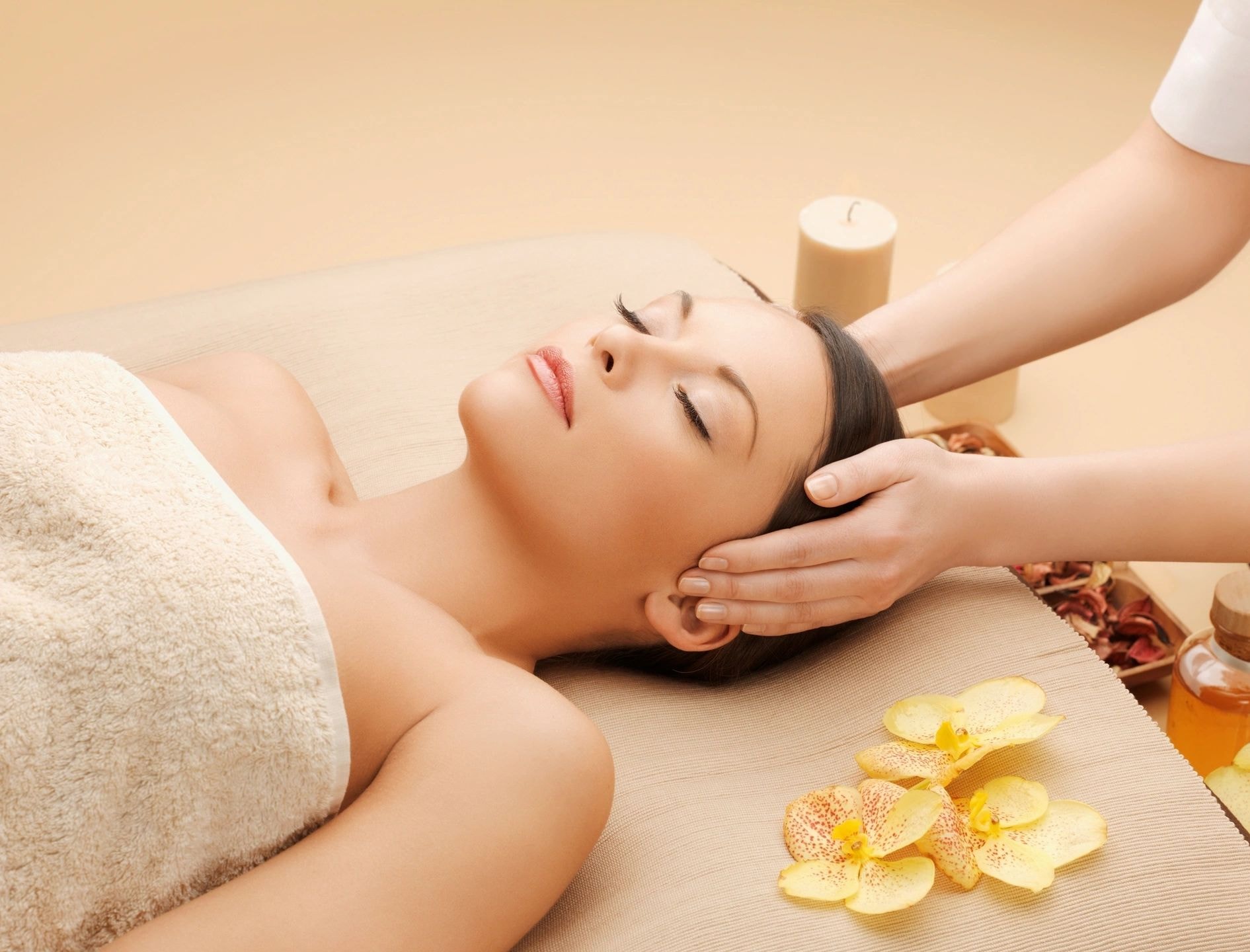 Woman receiving relaxing head massage spa